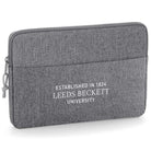 Gray laptop sleeve with 'Leeds Beckett University Established in 1824' text on a white background