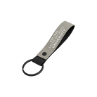 Keychain with 'Leeds Beckett University' text on a white background